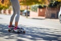 Detail of a female riding a skateboard on a street Royalty Free Stock Photo