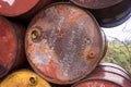Detail of fence made out of rusty empty fuel drums
