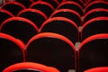 A few rows of red armchairs in an empty theater. Royalty Free Stock Photo