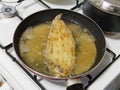 detail of a flounder fry in the oil Royalty Free Stock Photo