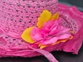 Detail of flowers on the women's pink straw hat