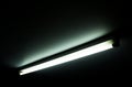 Detail of a fluorescent light tube on a wall