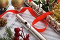 Detail of flute on music sheet ribbon and Christmas decoration Royalty Free Stock Photo