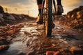 Detail focus Close up of mountain bike tire and riders foot on dirt road Royalty Free Stock Photo