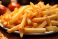 Detail focus golden perfection of French fries on tabletop