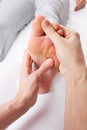 Detail foot reflexology massage Royalty Free Stock Photo