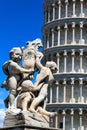 Detail of the Fountain Putti Fountain and the Leaning Tower of Pisa at the Piazza dei Miracoli in Pisa, Tuscany, Italy Royalty Free Stock Photo