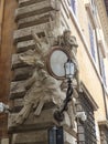 Baroque frame with a painting of Jesus in Via dei Coronari to Rome in Italy.