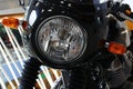 Detail of front mask with round headlight and classical oval orange winkers of former british, now indian made motorcycle