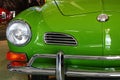Detail of front mask and round headlights of veteran classical german coupe car Volkswagen Karmann Ghia from year 1962