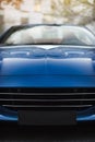 Detail of front side of a dark blue racing sport car