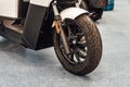 Detail of the front wheel of an utilitary motorbike Royalty Free Stock Photo