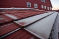 Detail of frost on a red barn roof