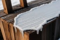 Detail of frost on a wooden signpost