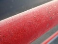 detail of a frozen red railing Royalty Free Stock Photo