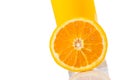 Detail of full glass of orange juice near half orange with space for text Royalty Free Stock Photo