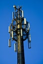 Detail of a 3G, 4G LTE transmitter tower against clear blue sky Royalty Free Stock Photo