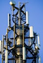 Detail of a 3G, 4G LTE transmitter tower against clear blue sky Royalty Free Stock Photo