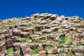 Detail of Giant`s Causeway rock formation against a blue sky Royalty Free Stock Photo