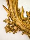 Detail of gilded frame of an antique mirror. Royalty Free Stock Photo