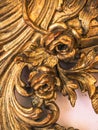 Detail of gilded frame of an antique mirror.