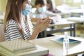 Close up of girl disinfects hands in class Royalty Free Stock Photo