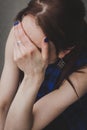 Detail of a girl hiding her face Royalty Free Stock Photo