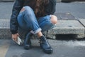 Detail of a girl posing in an urban context Royalty Free Stock Photo