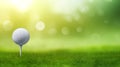 Detail of golf ball on white tee, green grass, green bokeh background Royalty Free Stock Photo