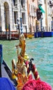 Detail Gondola of tourists in Venice