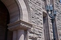 Detail of a Gothic-style building with a lamp post Royalty Free Stock Photo