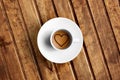 Detail of great italian espresso coffee in a white cup, top of view with foam heart shape