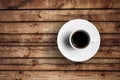 Detail of great italian espresso coffee in a white cup on wood table