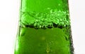 Detail of green bottleneck with liquid with bubbles isolated background