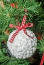 Detail of green Christmas (Chrismas) tree with colored ornaments Royalty Free Stock Photo