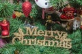 Detail of green Christmas (Chrismas) tree with colored ornaments, globes, stars, Santa Claus, Snowman Royalty Free Stock Photo