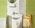 Detail of a green modern bathroom with sink Royalty Free Stock Photo