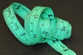 Detail of green tailor\'s tape measure in centimeters and inches Royalty Free Stock Photo