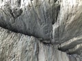 Detail of grey basalt rock on the black beach of Reynisfjara, Iceland