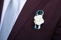 Detail groom wearing floral pins decoration jacket corsage Royalty Free Stock Photo