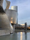 Detail of the Guggenheim Museum with Tall Tree And The Eye Sculpture in Bilbao, Basque Country, Spain, December 2019 Royalty Free Stock Photo