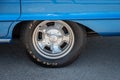 half-baked rear wheel of a classic blue Maerican Dodge Polara car. Radial wheel with drum brake