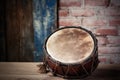 detail of a hand drum against a rustic backdrop