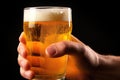 detail of hand holding a glass of pale lager beer Royalty Free Stock Photo