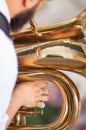 Detail on a hand plays tuba Royalty Free Stock Photo