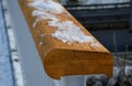 Detail of a handrail handle with rounded edges lacquered natural wood. glued with several pieces. in cross section you can see wha