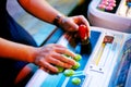 Detail on hands holding joystick and pushing buttons in a gaming room Royalty Free Stock Photo