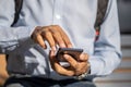 Detail of the hands of a Latino man using a mobile phone seen from the front Royalty Free Stock Photo