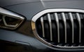 Detail of headlight from a modern car of european design. Metallic black paint Royalty Free Stock Photo