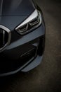 Detail of headlight from a modern car of european design. Metallic black paint Royalty Free Stock Photo